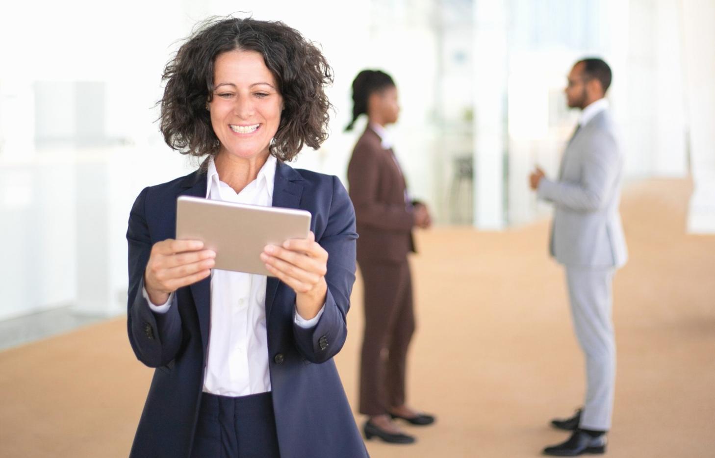 Business professional reviewing financial reports and analytics on computer screen